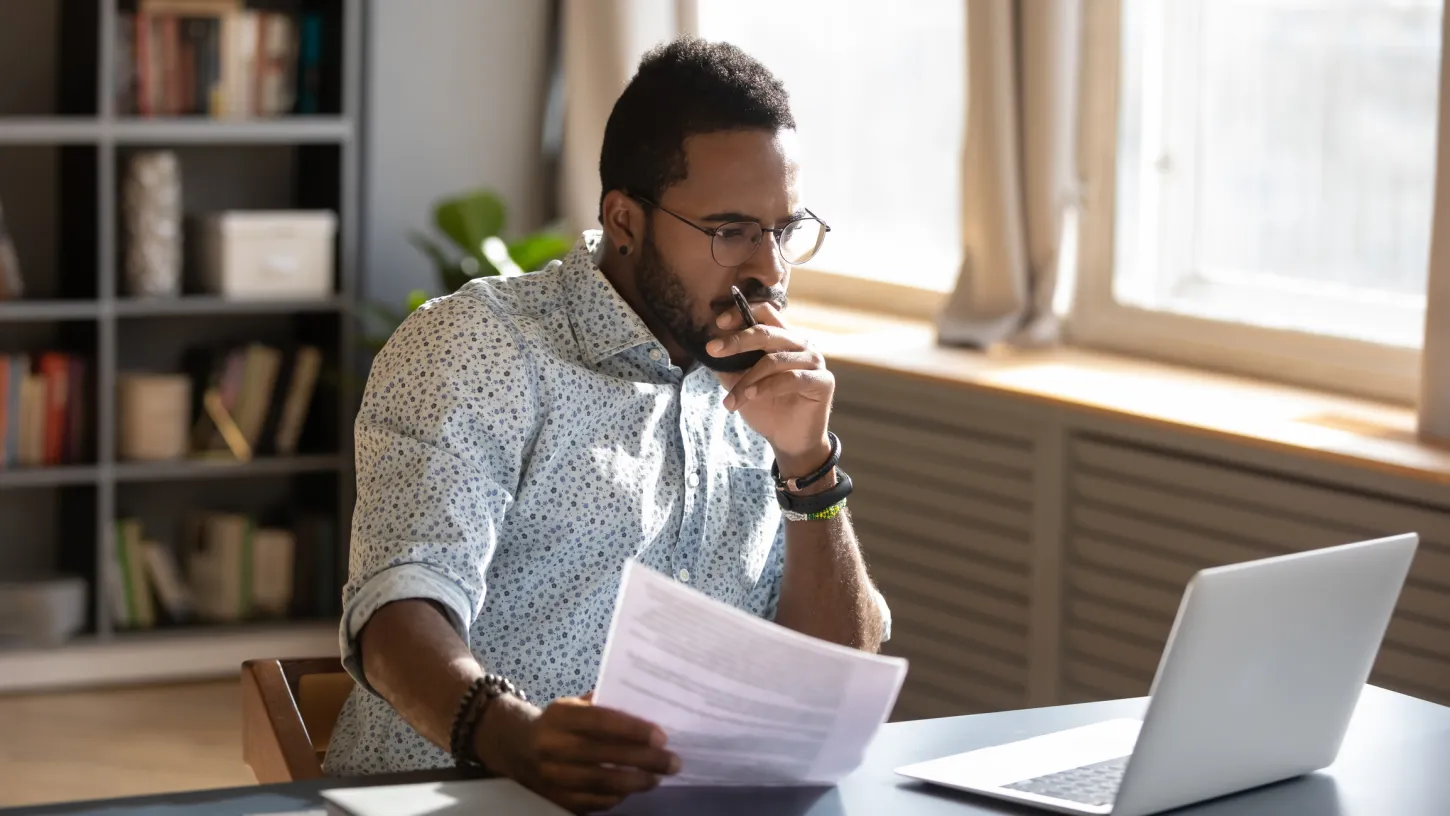 Man reading an informational white paper